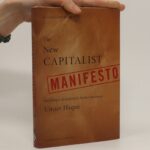 A hand holds up a book titled "The New Capitalist Manifesto" by Umair Haque. The brown cover features the word "Manifesto" highlighted in red. The subtitle reads "building a disruptively better business," with a foreword by Gary Hamel, challenging traditional notions of capitalism.