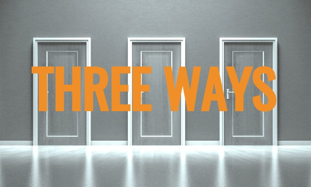 Three closed doors in a gray hallway with the text "THREE WAYS" in bold orange letters across the middle of the image. The doors are evenly spaced and identical in design, embodying sleek brand consistency. The floor is reflective, adding a mirrored effect to the scene.