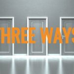 Three closed doors in a gray hallway with the text "THREE WAYS" in bold orange letters across the middle of the image. The doors are evenly spaced and identical in design, embodying sleek brand consistency. The floor is reflective, adding a mirrored effect to the scene.